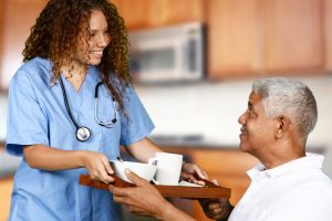 A doctor handing food to patient